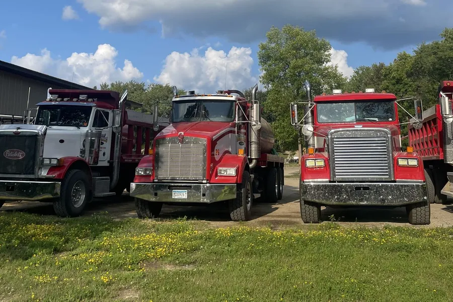 Shepard Excavating dump trucks outside the shop